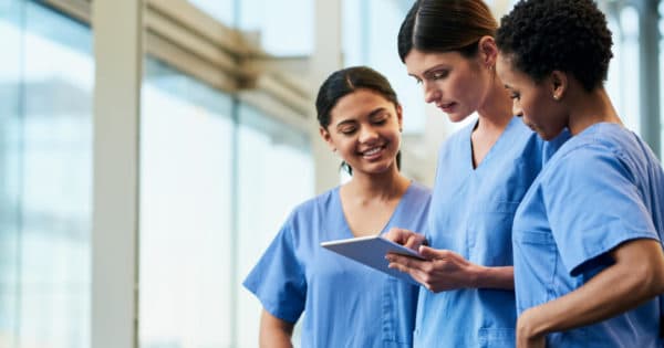 nurses discussing chart