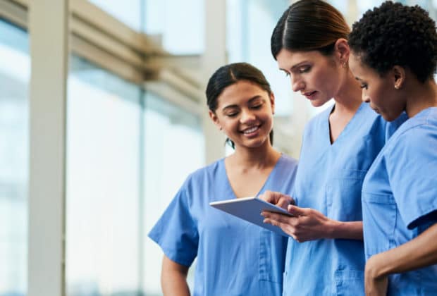 nurses discussing chart